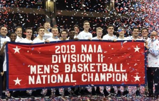 Group photo of men's basketball team after NAIA national championship win