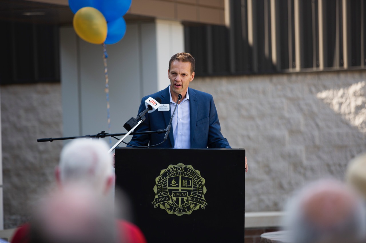 Ryan Cottingham speaking at McDonald Athletic Center dedication