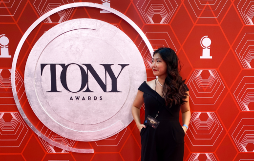 Kayla standing in front of Tony Awards sign