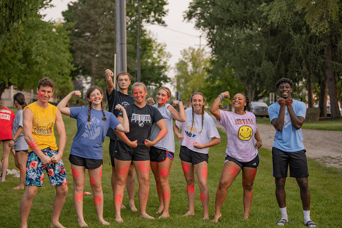 a group of smiling students covered in paint at the SAU event called crud wars
