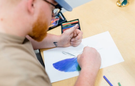 A student painting in class.